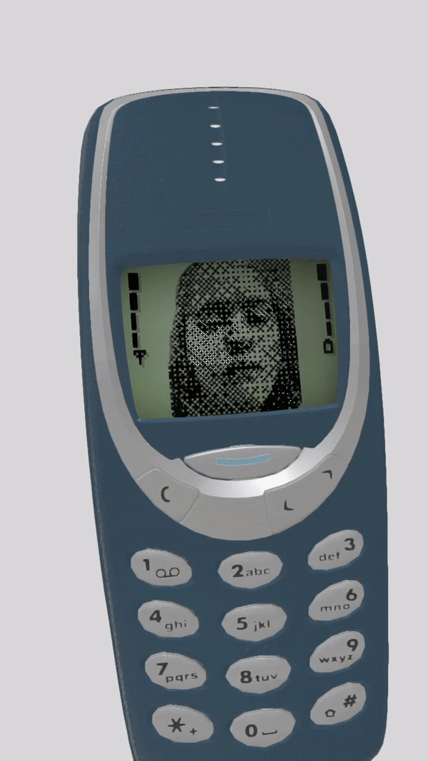 Author (La) in an animated old nokia phone with nose close to the camera lens as if peering in.